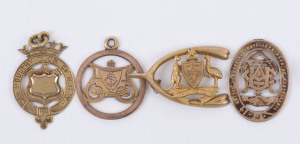 Four 9ct gold fobs, etc. (13.1gms); one presented by the Poultry Club of N.S.W. for the "Best Bird Wyong Show 1906"; another United Commercial Traveller Assoc. membership; an Australian Coat-of-Arms on a wishbone (lacks clasp) plus one more. (4).