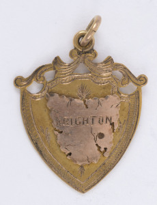 9ct gold fob (4.7gms) presented to Private Thomas William BRIGGS, 12th Battalion, by the residents of PONTVILLE BRIGHTON for his "Services in the GREAT WAR"; map of Tasmania on the front and engraved verso.