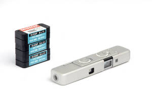 MINOX (Germany): Minox LX sub-miniature camera, 1985, [#2524483] in chrome, with leather case and chain. Accompanied by 3 unused film cassettes.