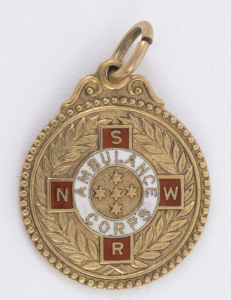 NEW SOUTH WALES AMBULANCE CORPS: 9ct gold fob (4.8gms) engraved verso "1942 EFFICIENT : A.I. HALL".