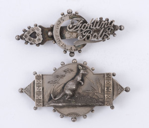 Two sterling silver brooches (lacking back clips) circa 1900; one depicts a kangaroo in a landscape; the other with "Fighting Bobs" and engraved "South Africa". (2).