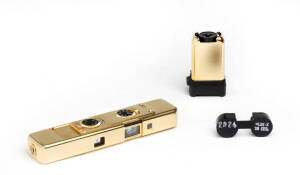 MINOX (Germany): Minox LX Gold "Selection" 1987-88, [Limited edition #209/999] to commemorate the 50th Anniversary of Minox. With flash attachment, chain and 2 leather cases in wooden presentation box.