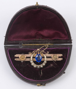 An antique 9ct rose gold bar brooch set with blue stone and seed pearls, late 19th century, stamped "9ct" with pictorial marks, 5cm wide, 5 grams total