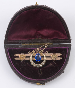 An antique 9ct rose gold bar brooch set with blue stone and seed pearls, late 19th century, stamped "9ct" with pictorial marks, ​5cm wide, 5 grams total