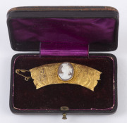 An unusual antique cameo brooch set in high carat gold frieze, 19th century, ​5.5cm wide, 6.5 grams total