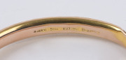 A lady's antique 9ct gold bangle with engraved decoration, late 19th century, 7cm wide, 6.6 grams total. Housed in plush velvet box branded "J.M. WENDT, ADELAIDE", - 3