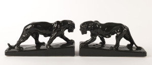 A pair of charcoal glaze pottery panther bookends, 12.5cm high, 24cm wide