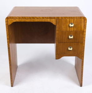 An Australian Art Deco three drawer desk, Queensland maple with bakelite and chrome handles, circa 1930, 77cm high, 76cm wide, 47cm deep