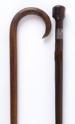 Two walking sticks, one snakewood with silver collar inscribed "Presented To A. HESFORD On His Promotion To Sub Inspector By His Comrades At Castlemaine", the other fiddleback blackwood, early 20th century, 83cm and 92cm high