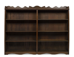 An Australian library bookcase with adjustable shelves, stained kauri pine early 20th century, ​163cm high, 210cm wide, 30cm deep