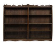 An Australian library bookcase with adjustable shelves, stained kauri pine early 20th century, ​163cm high, 210cm wide, 30cm deep