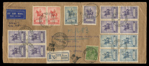 AUSTRALIA: Other Pre-Decimals: 1935 (SG.158) Silver Jubilee 2/- blocks of 4 (2) plus single, 3d block of 4 plus single, 2d pair & KGV 1d green on 1935 (Jun.4) registered airmail cover (266x113mm) to South Africa, adhesives all tied by 'REGISTERED/SYDNEY NSW' datestamps, blue/white registration label tied by 'LATE/FEE' handstamp, ALEXANDRIA (Egypt) transit backstamp and 'REGISTERED/JOHANNESBURG' arrival datestamp on the face few trivial blemishes. A truly remarkable and spectacular franking.
