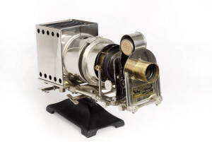 NATIONAL PICTURES SERVICE Inc. (U.S.A.): Great National No. 1 Stereopticon No. 6487;&nbsp;bright-nickelled metal body, electric illuminant, condensing lenses, a pair of extending connecting rods, film holder, and a 3&frac12; inch lens, on an adjustable metal base.