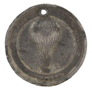 Medallions & Badges: COPPIN'S BALLOON - AEROSTATIC MEDAL: in white medal, 38mm diameter, verso inscribed 'CREMORNE GARDENS/VICTORIA 1858', pierced at top. Rare. George Coppin was an English-born comic actor, entrepreneur & politician, who resided in Australia for much of his life. In c.1855 he purchased the Theatre Royal and the Cremorne Pleasure Gardens, Richmond, from whence the balloon flights departed.