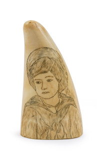 A scrimshaw whale's tooth with a portrait of a boy ​11cm high