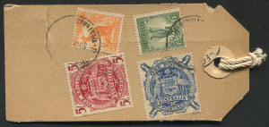 AUSTRALIA: Postal History: PARCEL TAGS/LABELS: c. early 1950s tag for Millars' Timber & Trading Co. with £1 Arms, 5/- Arms, 1/- Lyrebird & ½d Roo tied by REGISTERED PERTH datestamps (year date illegible), addressed to Harvey (WA); tear well clear of the adhesives. The parcel likely contained the company payroll, and would have been sent at letter rate as coins and bullion could not be sent at parcel rate.