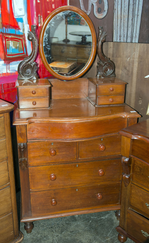 An antique Australian cedar Duchess chest with serpentine front, 19th century, 177cm high, 89cm wide, 47cm deep