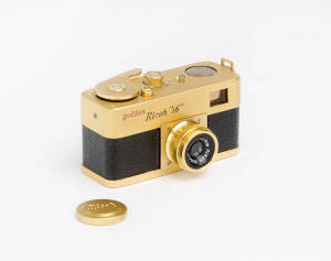 RIKEN OPTICAL (Japan): Golden Ricoh 16, c1957, sub-miniature camera for 10x14mm exposures on 16mm film; with Ricoh f3.5 25mm lens (with cap) in maker's leather ERC.