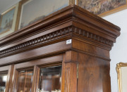 An Australian cedar bookcase, two doors with bevelled glass panels, four drawers, dentil moulded pediment and adjustable shelves, late 19th century, 211cm high, 155cm wide, 43cm deep - 4