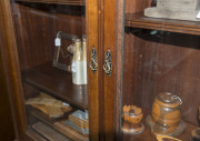 An Australian cedar bookcase, two doors with bevelled glass panels, four drawers, dentil moulded pediment and adjustable shelves, late 19th century, 211cm high, 155cm wide, 43cm deep - 6