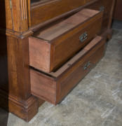 An Australian cedar bookcase, two doors with bevelled glass panels, four drawers, dentil moulded pediment and adjustable shelves, late 19th century, 211cm high, 155cm wide, 43cm deep - 8