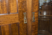 An Australian Arts & Crafts wardrobe, fiddleback blackwood with copper strap hinges and fine repouss&eacute; panels, circa 1900, 230cm high, 216cm wide, 71cm deep - 7