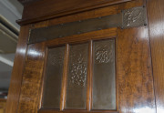 An Australian Arts & Crafts wardrobe, fiddleback blackwood with copper strap hinges and fine repouss&eacute; panels, circa 1900, 230cm high, 216cm wide, 71cm deep - 15