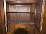 A fine Colonial Beaconsfield gentleman's wardrobe with inverted breakfront, Australian cedar with huon pine secondary timbers and blackwood knobs, Tasmanian origin, circa 1850. Bearing label on the back "A. JONES, LAUNCESTON". 203cm high, 220cm wide, 70cm - 6