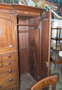 A fine Colonial Beaconsfield gentleman's wardrobe with inverted breakfront, Australian cedar with huon pine secondary timbers and blackwood knobs, Tasmanian origin, circa 1850. Bearing label on the back "A. JONES, LAUNCESTON". 203cm high, 220cm wide, 70cm - 7