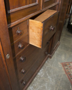 A fine Colonial Beaconsfield gentleman's wardrobe with inverted breakfront, Australian cedar with huon pine secondary timbers and blackwood knobs, Tasmanian origin, circa 1850. Bearing label on the back "A. JONES, LAUNCESTON". 203cm high, 220cm wide, 70cm - 8