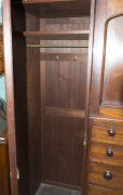 A fine Colonial Beaconsfield gentleman's wardrobe with inverted breakfront, Australian cedar with huon pine secondary timbers and blackwood knobs, Tasmanian origin, circa 1850. Bearing label on the back "A. JONES, LAUNCESTON". 203cm high, 220cm wide, 70cm - 10