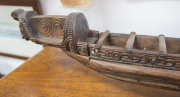 A Maori miniature canoe, carved wood and paua shell, New Zealand, 20th century, 101cm long - 4