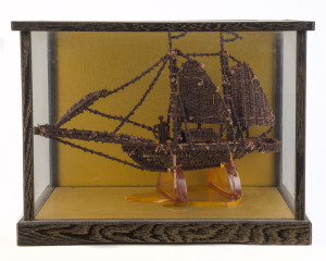 KAPAL AMBON model boat in cabinet, made from clove spices, with attached plaque "KAPAL AMBON, Trading boat of the Spice Islands (Moluccas) Made From Cloves. Presented by Dr. B. Faragher, Dr. B. Dunn", the cabinet 23cm high, 31cm wide, 17cm deep