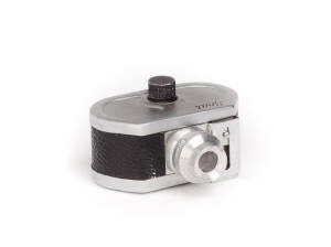 S.C.A.T. (Italy): Scat, c1950, subminiature camera for 7x10mm exposures on 16mm film; f3.5 lens, single speed revolving shutter and leather covered metal body. With original box and printed instruction leaflet. .