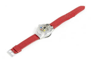 STEINECK KAMERAWERK (Germany): Steineck A-B-C wristwatch camera, c1949, for 8 exposures on circular film in a special magazine; with Steinheil f2.5 12.5mm lense and red leather wristband.