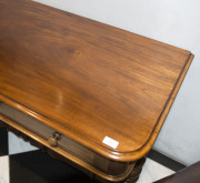 ANDREW LENEHAN Colonial Australian cedar hall table with two drawers and double turned stretcher base, Sydney, New South Wales, mid 19th century. Bearing original circular paper label "A. Lenehan's Cabinet and Upholstery Establishment, 179 Castlereagh Str - 5