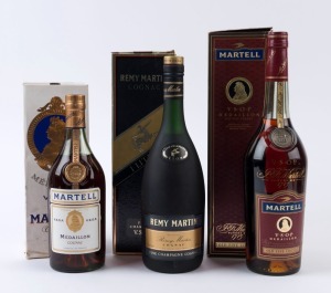 COGNACS: Martell Médaillon. V.S.O.P. Cognac, France, 700 ml. (1970s bottle & box); also, a 1 Litre bottle (1990s; with box); and Remy Martin Fine Champagne Cognac, 1 Litre bottle with box). Total: 3 bottles.