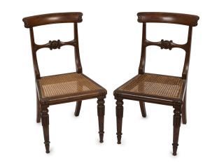 A fine pair of antique mahogany spade back dining chairs with rush seats, circa 1820