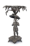 An antique silver plated figural stand, 19th century, ​​​​​​​20cm high