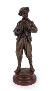 An antique French statue of a boy, patinated cast metal on faux rouge marble base, late 19th century, 34cm high