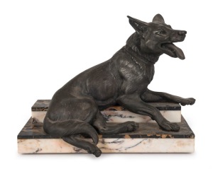 A French Art Deco statue of a recumbent dog, patinated spelter and marble, circa 1930, 28cm high, 35cm wide