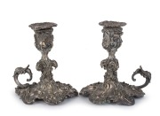 A pair of Rococo style silver plated chamber sticks, 19th century, ​​​​​​​12.5cm high