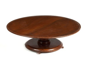 Australian cedar lazy Susan in the Georgian style, early to mid 20th century, with Brisbane manufacturer's label, 18cm high, 56cm diameter
