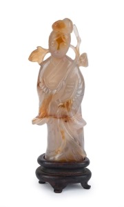An antique Chinese carved jade statue of a lady holding a branch, Qing Dynasty 18th/19th century. 13cm high