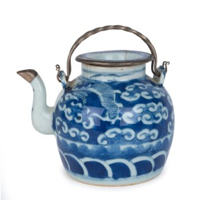 A Chinese blue glazed ceramic teapot with later silver restorations to rim and spout, early Qing Dynasty, ​13cm high including handle