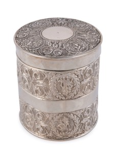 An antique Indian silver tea caddy of cylindrical form with scrolling foliate decoration, 19th century, maker's mark to base, 8.5cm high, 7.5cm diameter, 110 grams