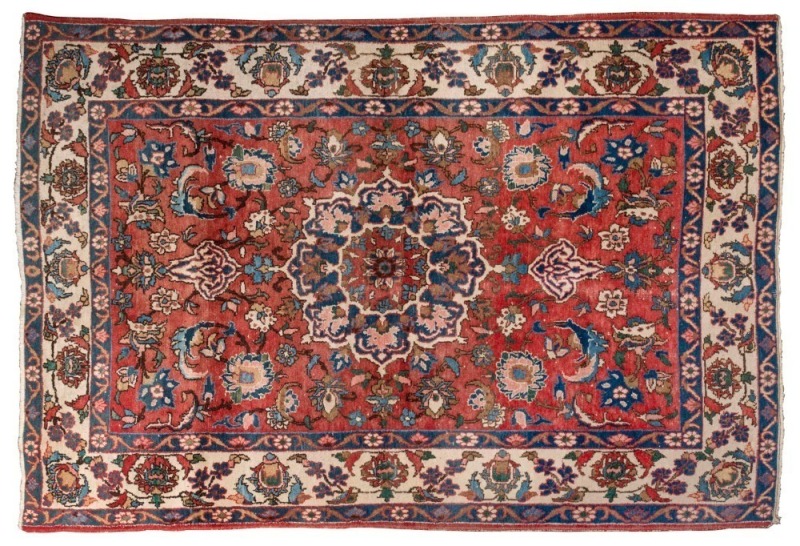 A floral patterned Persian rug with red and cream background, ​208 x 144cm