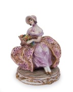 GUIDO CACCIAPUOTI (1892-1953), Italian porcelain statue of a seated lady, early to mid 20th century, incised signature "Cacciapuoti", with remains of original paper label, ​18cm high