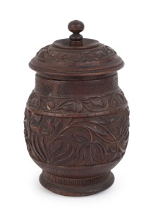 An antique Indian carved wooden jar with lid, 18th/19th century, ​18cm high