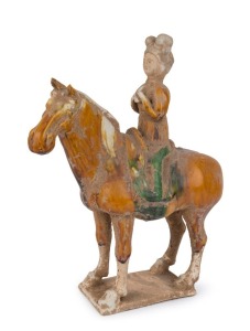 A Chinese Tang style pottery horse with rider, Qing Dynasty, 19th century, ​37cm high